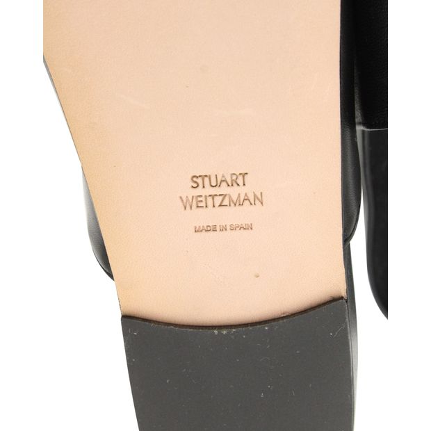 Stuart Weitzman Flat Mules in Black Leather
